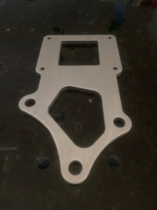 Aftermarket ignition coil bracket for automotive use